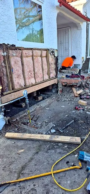 Structural repair with exposed framing and insulation