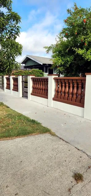 Balustrade fence along a sidewalk