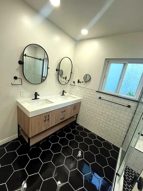 Bathroom with double oak vanity and round mirrors