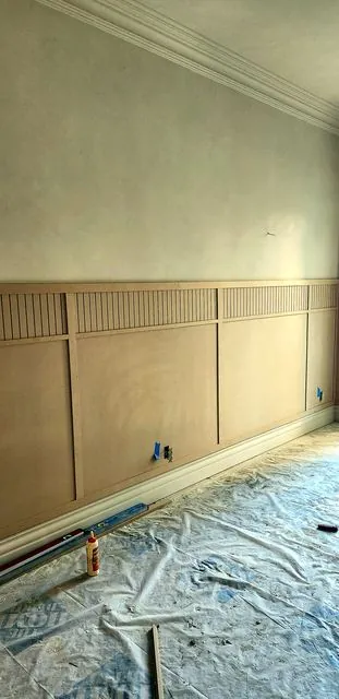 Custom wainscoting panels on a living room wall
