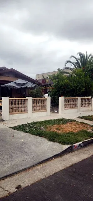 Unpainted concrete balustrade fence